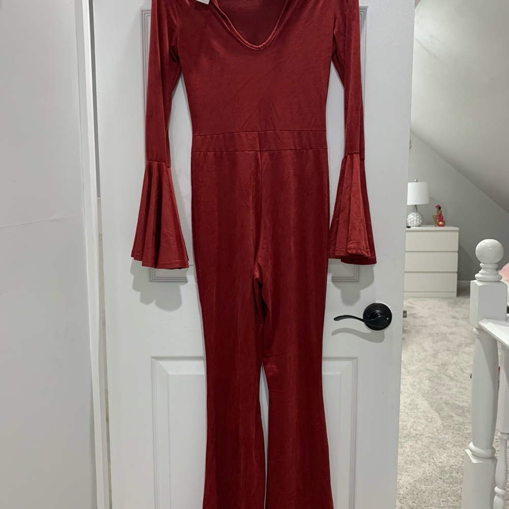 Jumpsuit.  Bell sleeves Stretchy fabric.